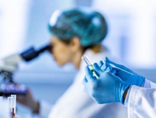 Woman using microscope