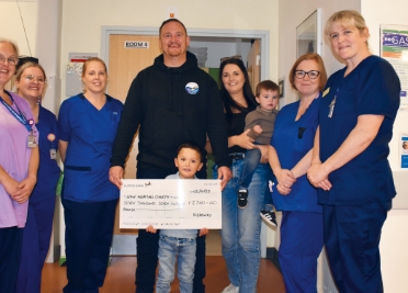 Fundraiser, Nate, with his family and some of the N&N staff