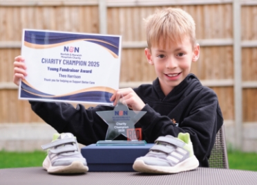 Young Fundraiser, Theo Harrison, with his N&N Charity Champion 2025 certificate and trophy
